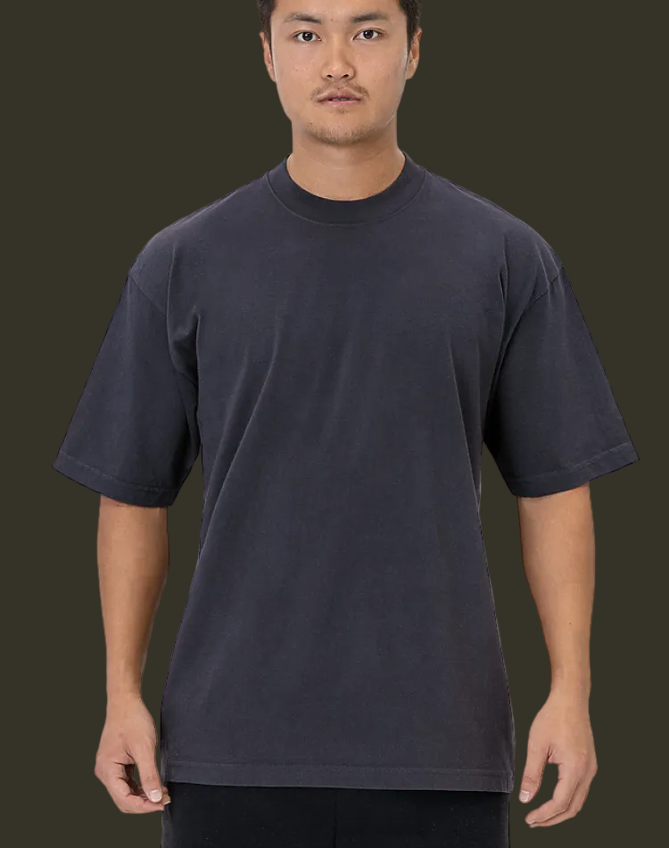 Man wearing a plain black t-shirt and pants on a white background